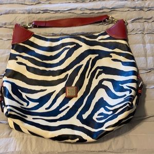 Zebra print Dooney & Bourke over the shoulder bag.